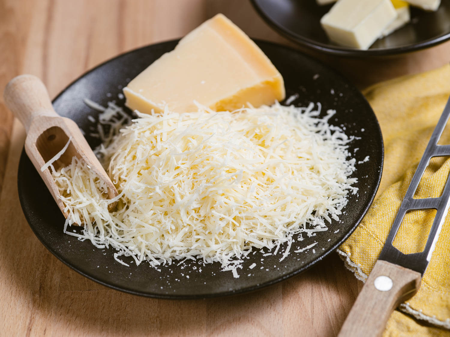Close-up of freshly grated Parmesan cheese for finishing creamy polenta.

