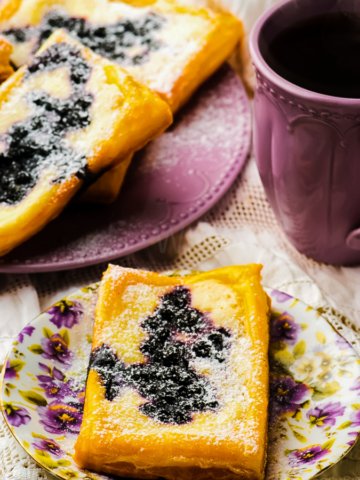 Easy Puff Pastry Blueberry Cheese Danish topped with fresh blueberries and a creamy filling, served warm