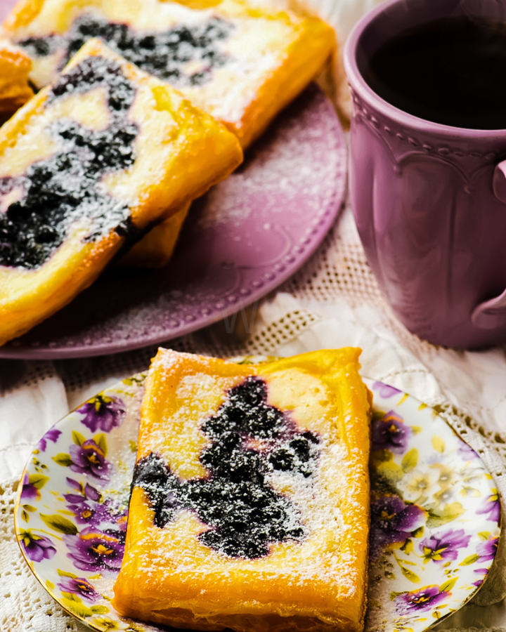 Easy Puff Pastry Blueberry Cheese Danish topped with fresh blueberries and a creamy filling, served warm