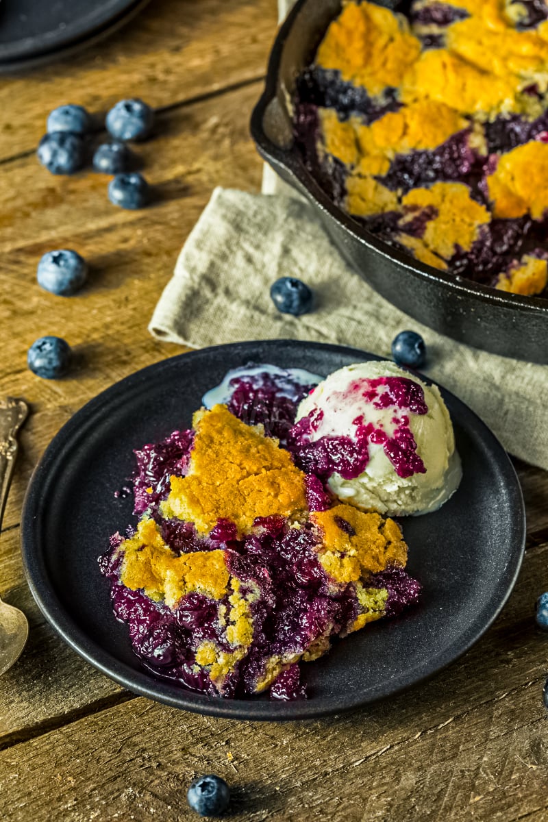 Easy blueberry cobbler with fresh or frozen berries, golden crust and juicy blueberry filling served with vanilla ice cream