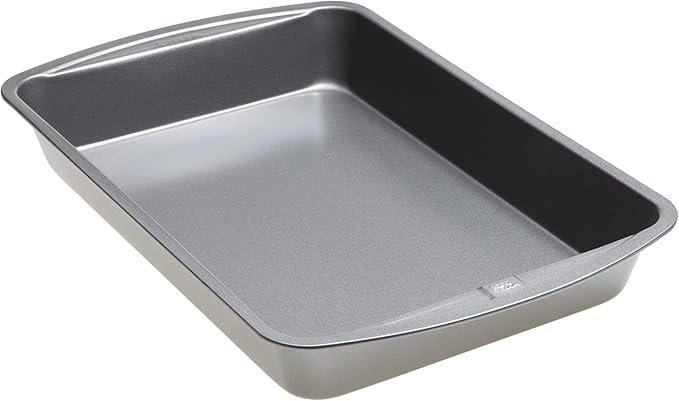 Rectangular metal baking pan used for making blueberry cobbler or baked desserts