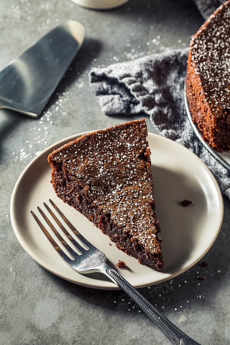“Rich chocolate olive oil cake dusted with powdered sugar”