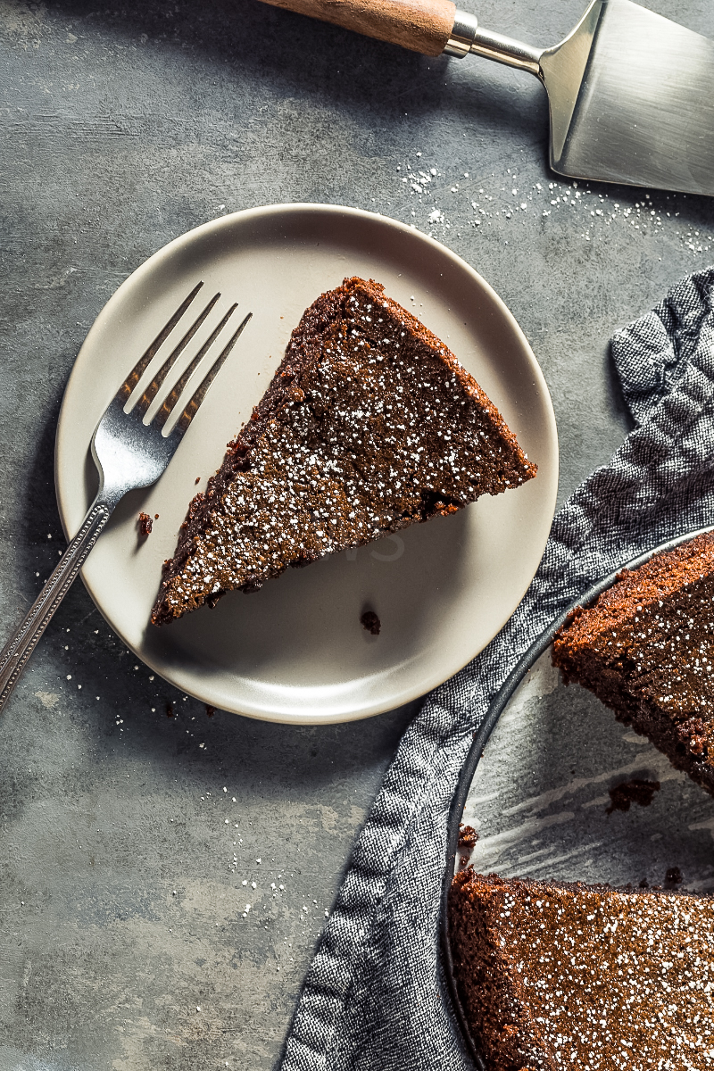 “Rich chocolate olive oil cake dusted with powdered sugar”