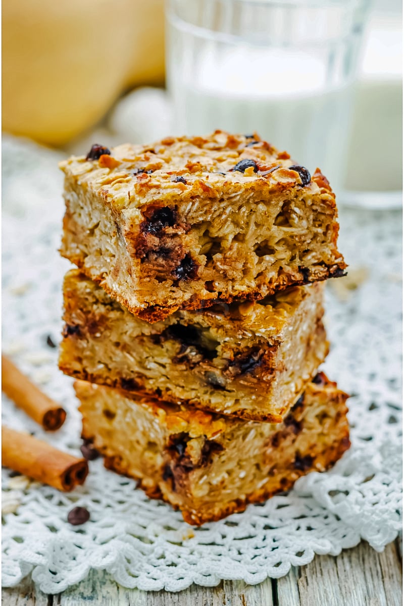 Chewy Pumpkin Cinnamon Chip Oatmeal Bars stacked on a plate