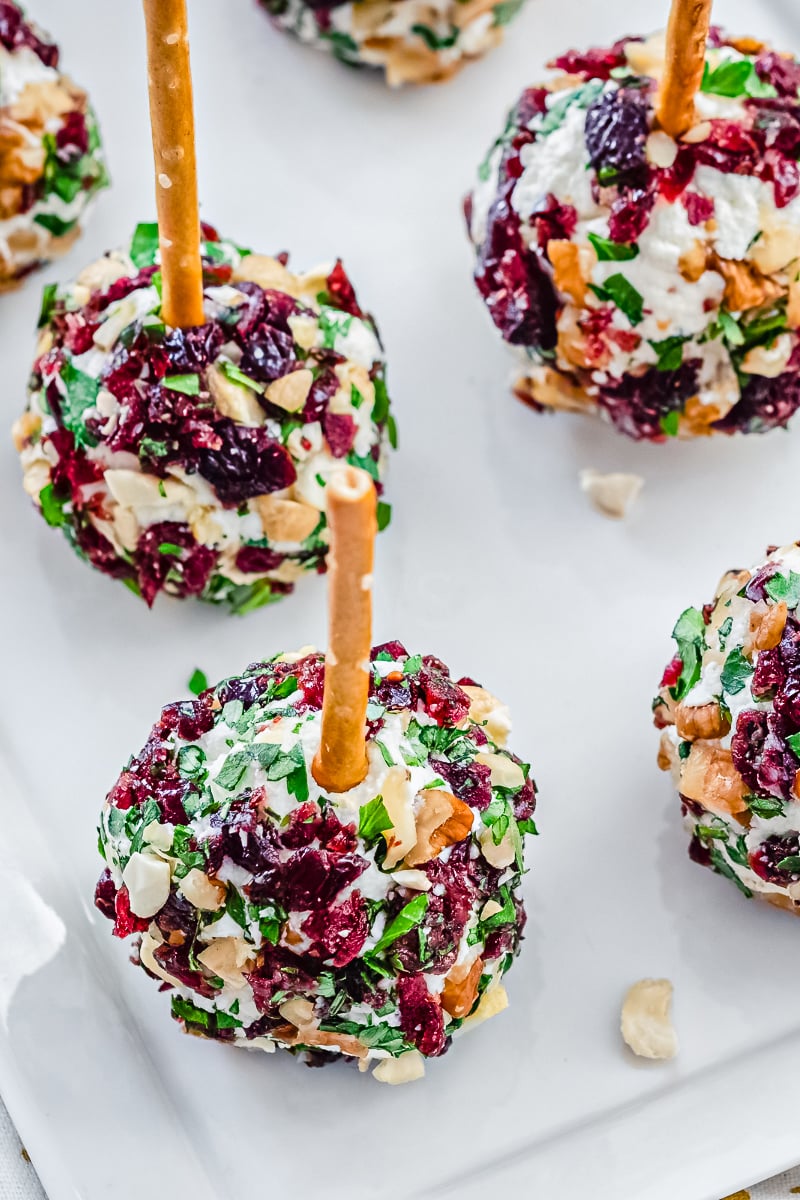Cranberry Cheese Ball on festive holiday platter with crackers