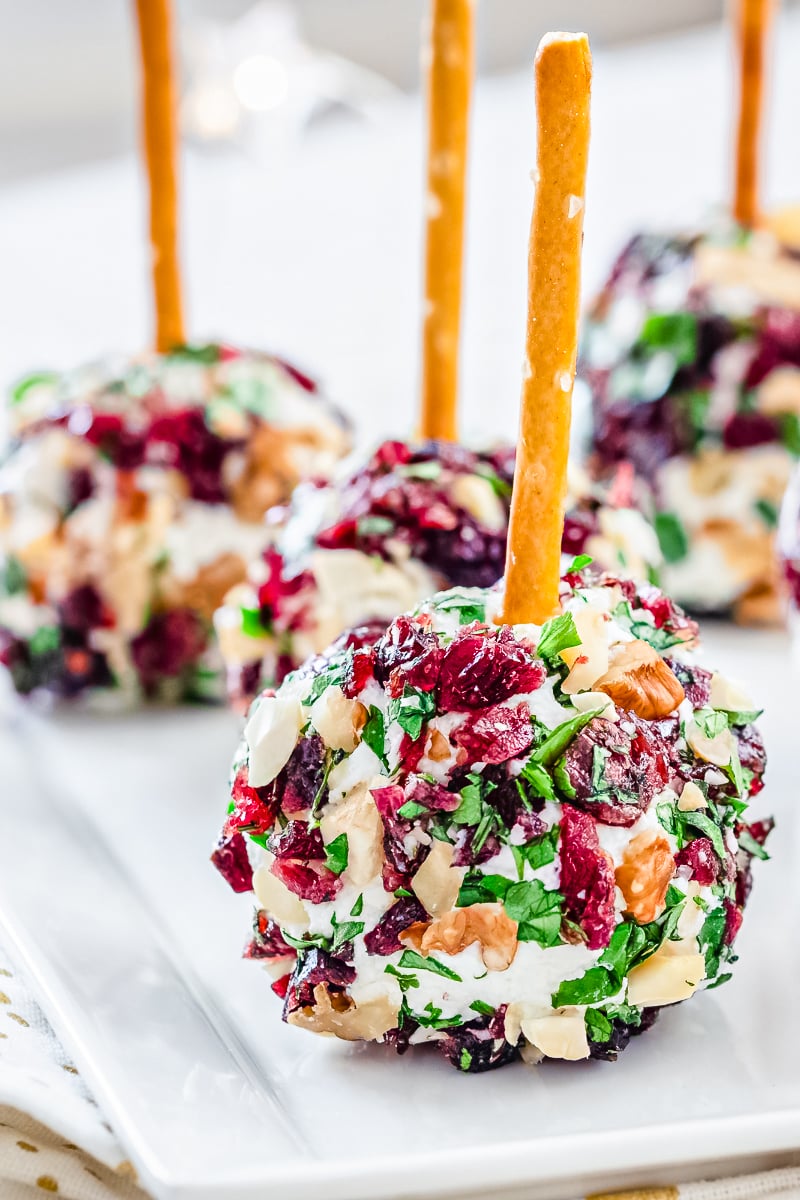 Cranberry Cheese Ball on festive holiday platter with crackers