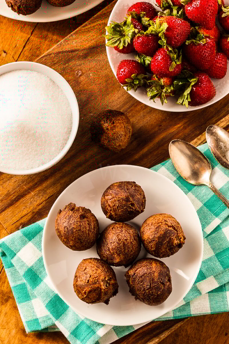 Close-up of air fryer donut holes with deep chocolate color and fudgy interior, served as a quick homemade treat.