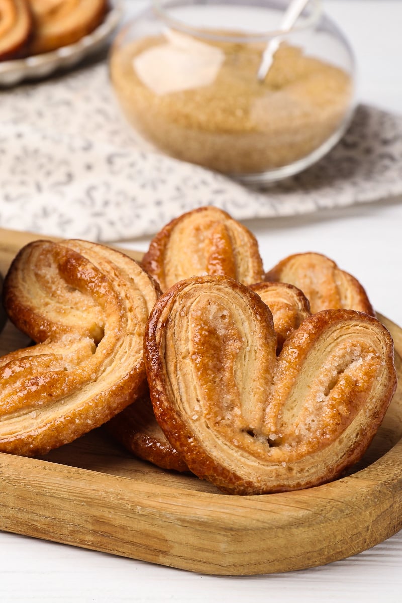 Crispy, buttery French Palmier cookies on a plate, golden and crunchy, ready for afternoon tea.