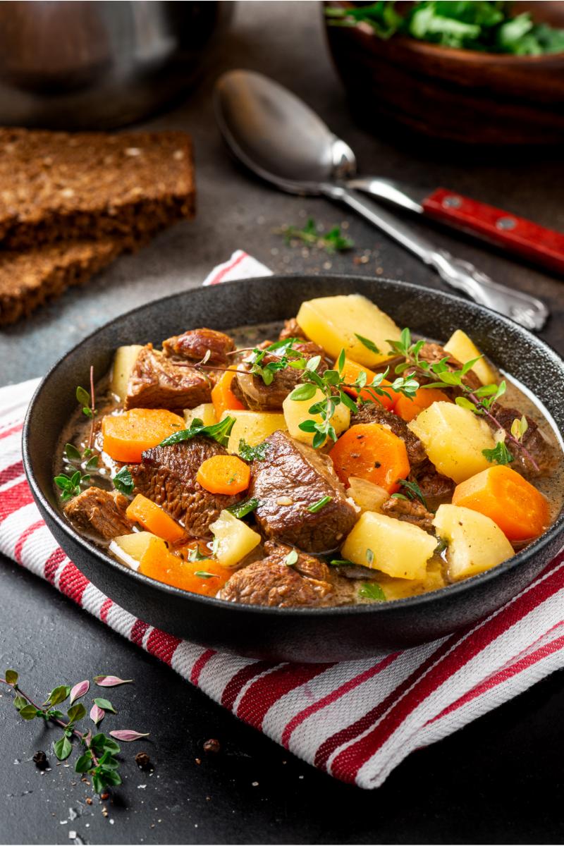 Irish beef stew served hot in a bowl, slow-simmered beef and vegetables perfect for cold weather