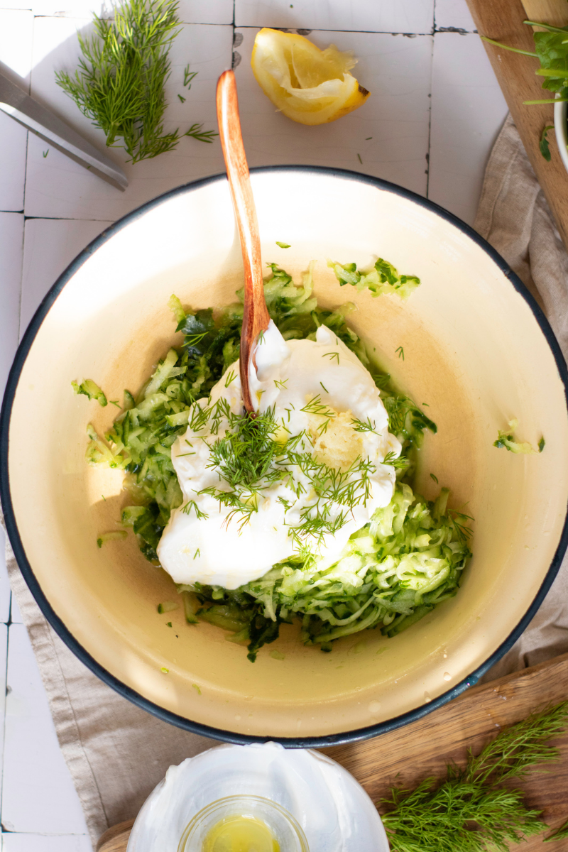 Greek yogurt, grated cucumber, fresh dill, lemon, garlic, and olive oil mixed together for homemade tzatziki sauce.