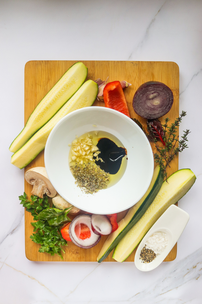 Balsamic marinade with olive oil, garlic, Italian herbs, salt, and pepper for grilled vegetables
