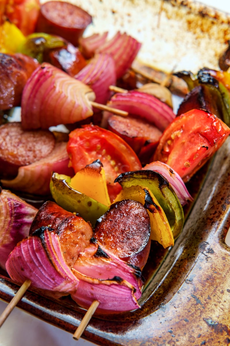 Kielbasa shish kebab skewers loaded with smoked sausage, colorful bell peppers, red onion, mushrooms, and tomatoes grilled until lightly charred and juicy.