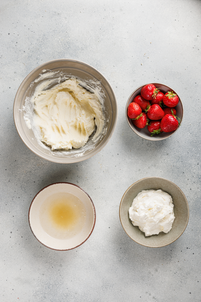 Smooth cream cheese cheesecake filling being mixed for no-bake strawberry cheesecake.