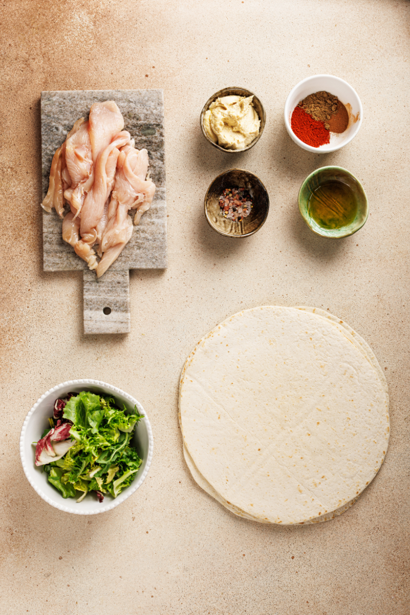 Chicken breast sliced into thin strips for Moroccan chicken wraps