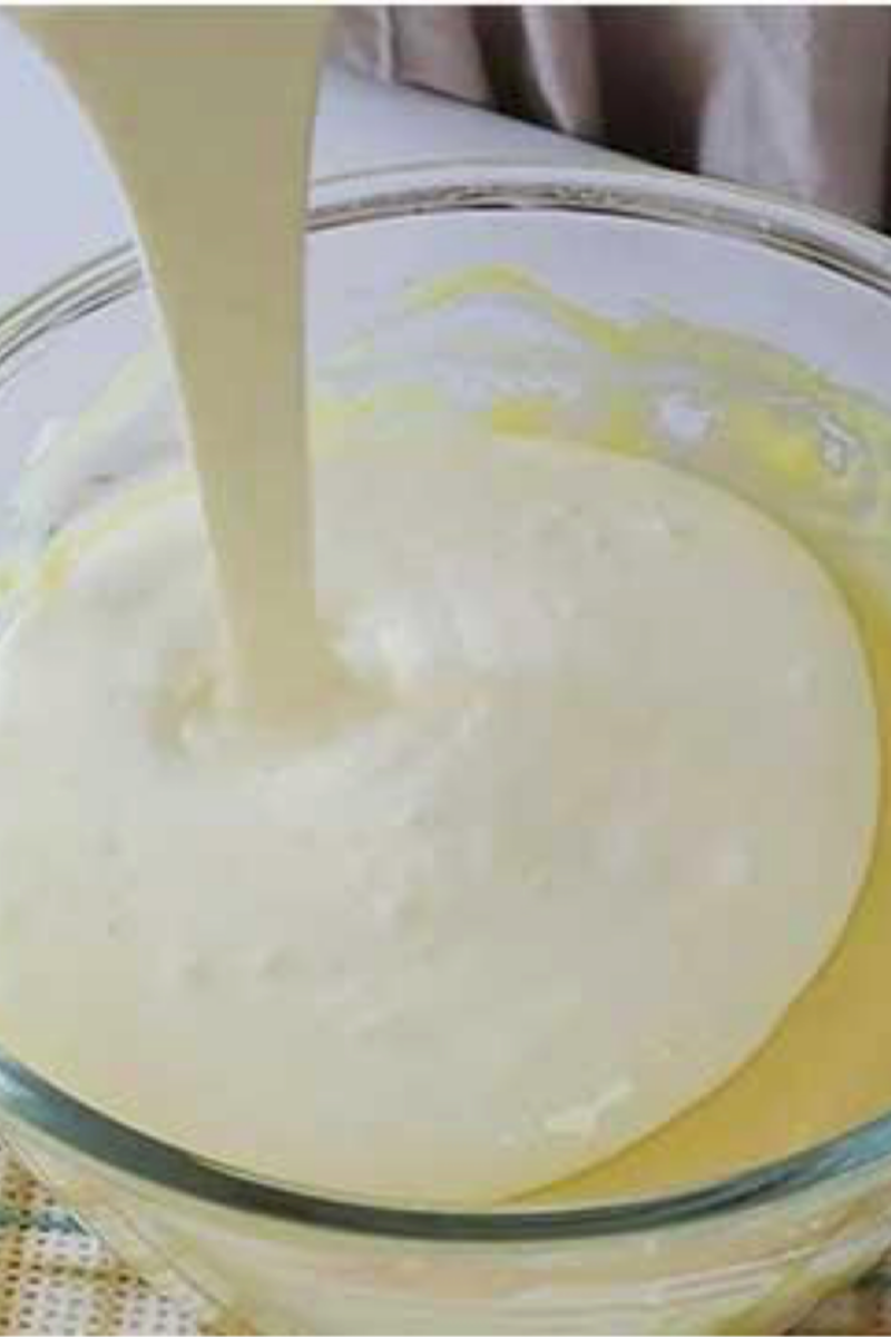 Whipped cream folded into mascarpone mixture to create blueberry tiramisu filling
