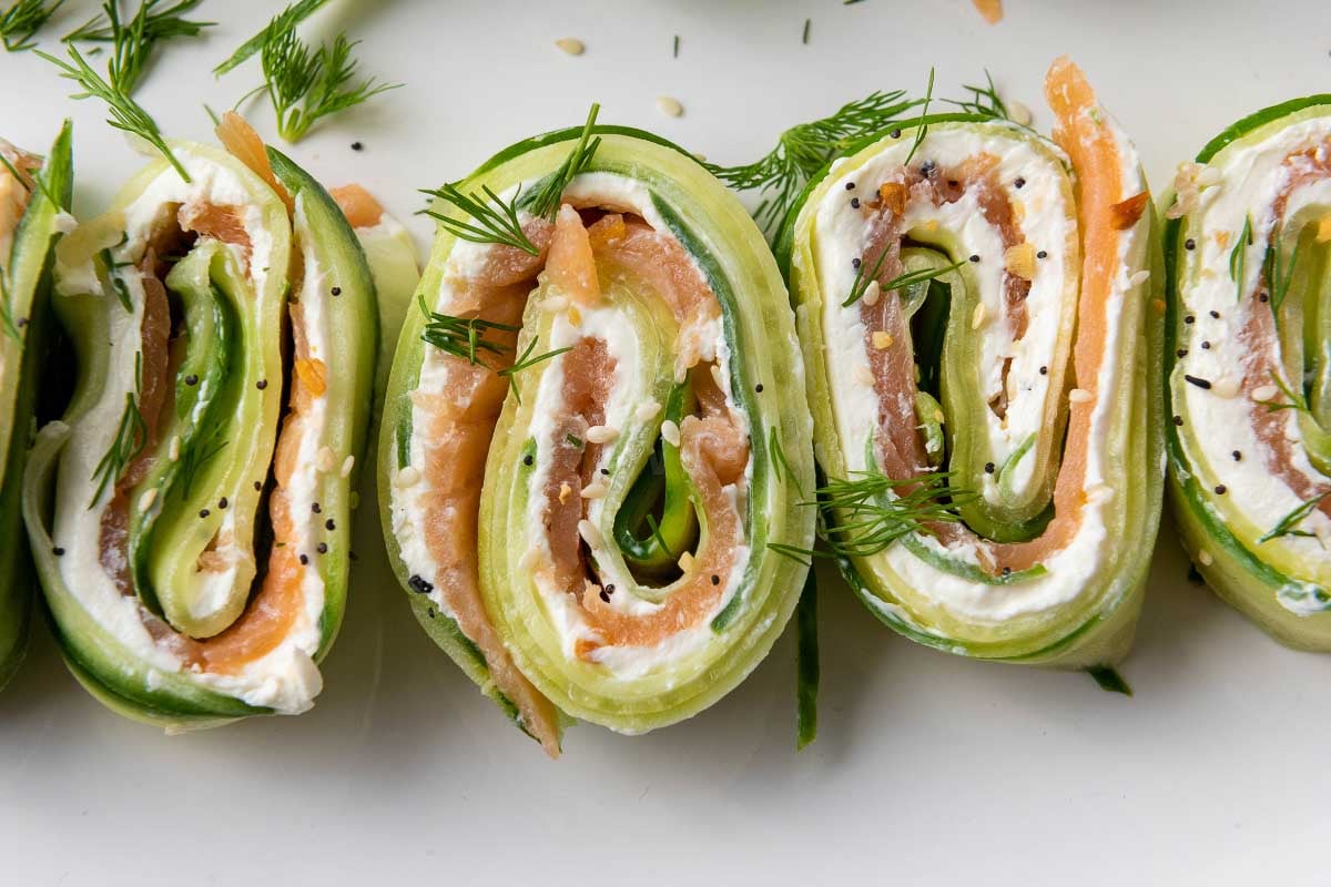 Fresh Everything Bagel Cucumber Rolls served as a low-carb appetizer with smoked salmon, cream cheese, and dill.