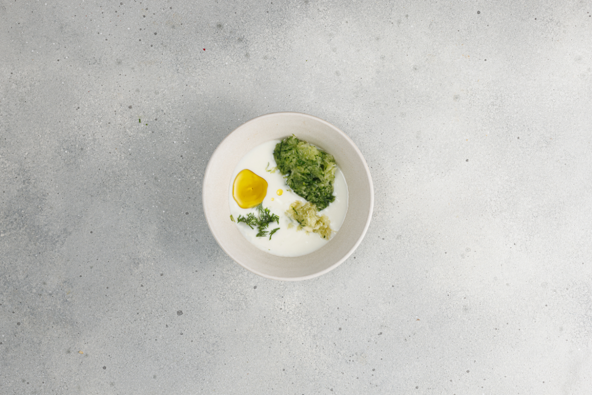 Fresh herbs added to creamy homemade tzatziki.