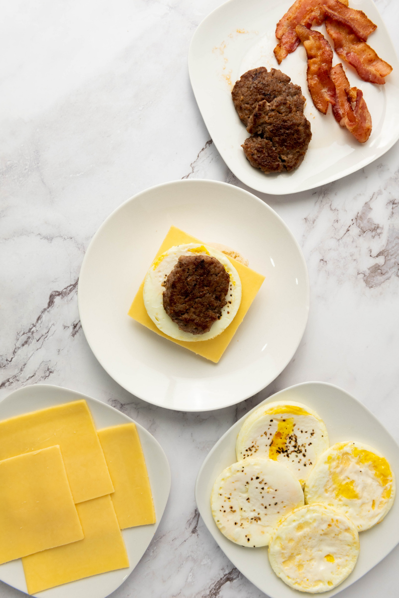 Breakfast sausage patty layered over egg and cheese.