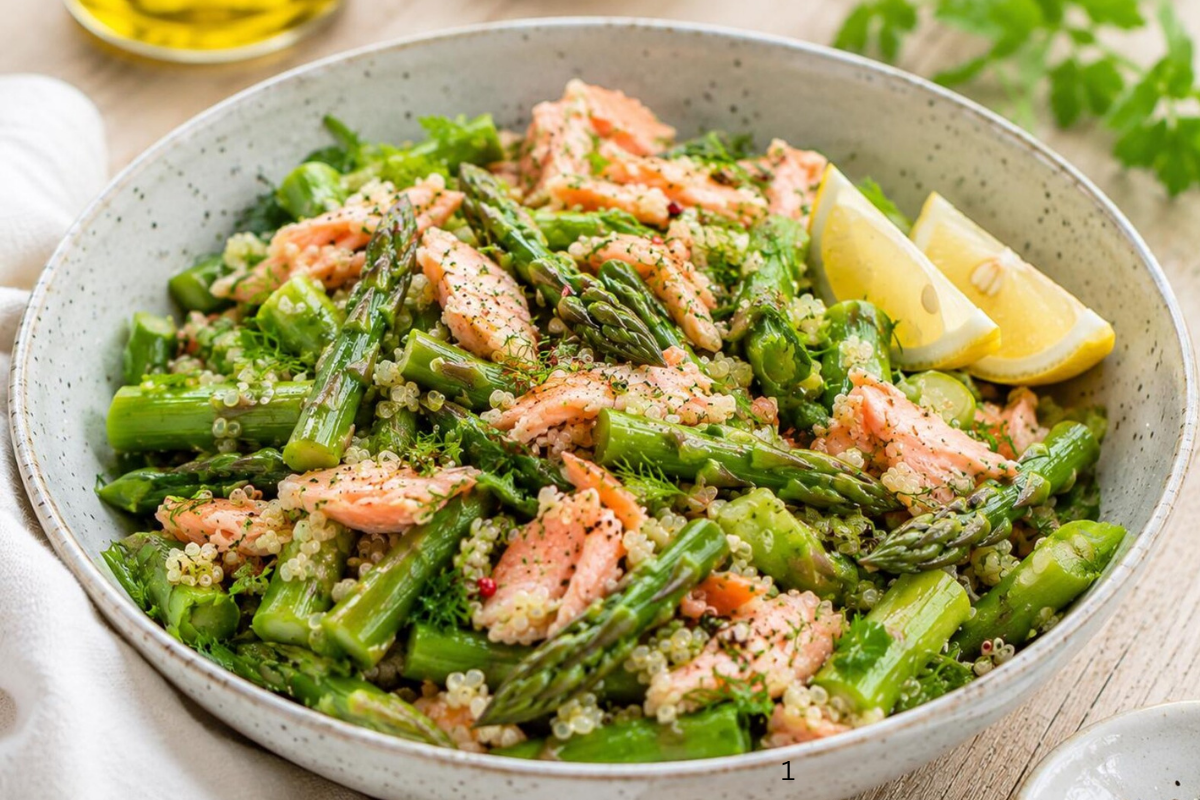 Finished Fresh Asparagus & Shrimp Salad garnished with shrimp, avocado, tomatoes, and spring onions, ready to serve as a light healthy meal.