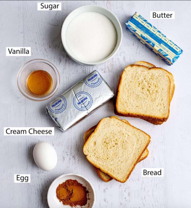 Ingredients for stuffed cinnamon-sugar French toast sticks including bread, cream cheese, egg, vanilla, butter, cinnamon, and sugar.